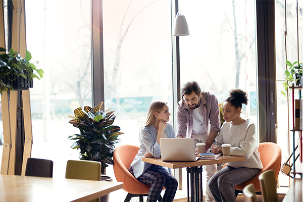 three people working together