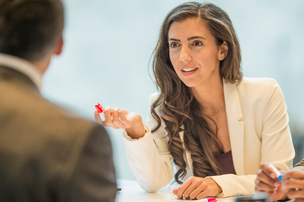 A woman speaking in a meeting