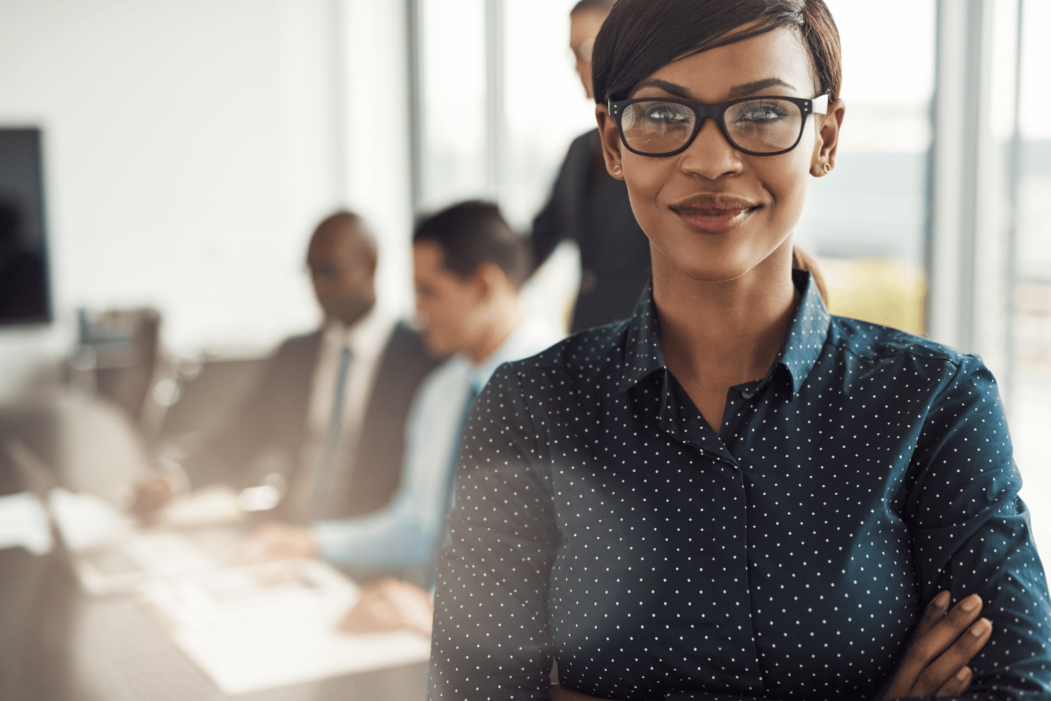 A woman posing at an office