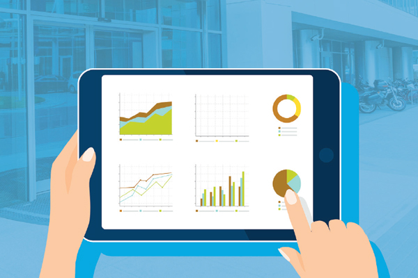 Illustration of hands holding a tablet displaying various colorful graphs and charts, including line graphs, bar charts, and pie charts, with an office building visible in the blurred background.