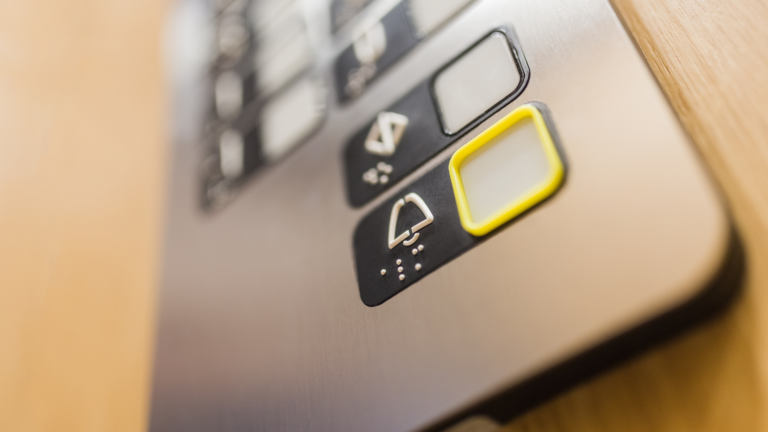 A close up of elevator buttons