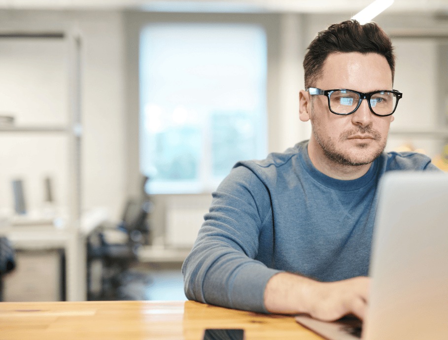 A man working on his certification on his laptop